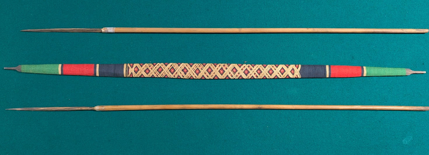 Handcrafted Indigenous style wooden bow with woven grip and two arrows in tribal design