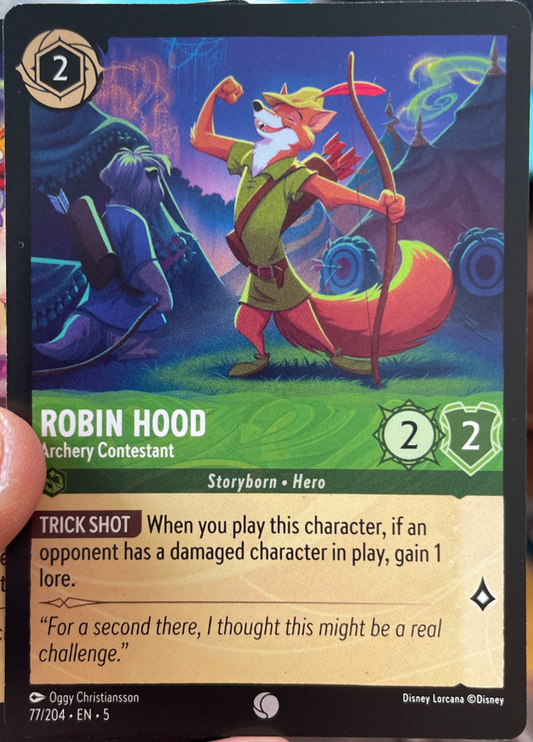 Disney Lorcana Robin Hood – Archery Contestant card featuring Emerald Storyborn Hero with archery theme and Trick Shot ability