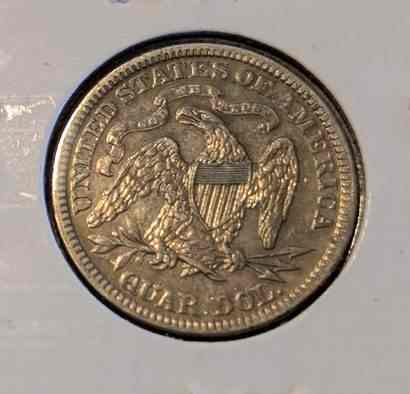 1891 Liberty Seated Quarter with Lady Liberty and "In God We Trust" motto.