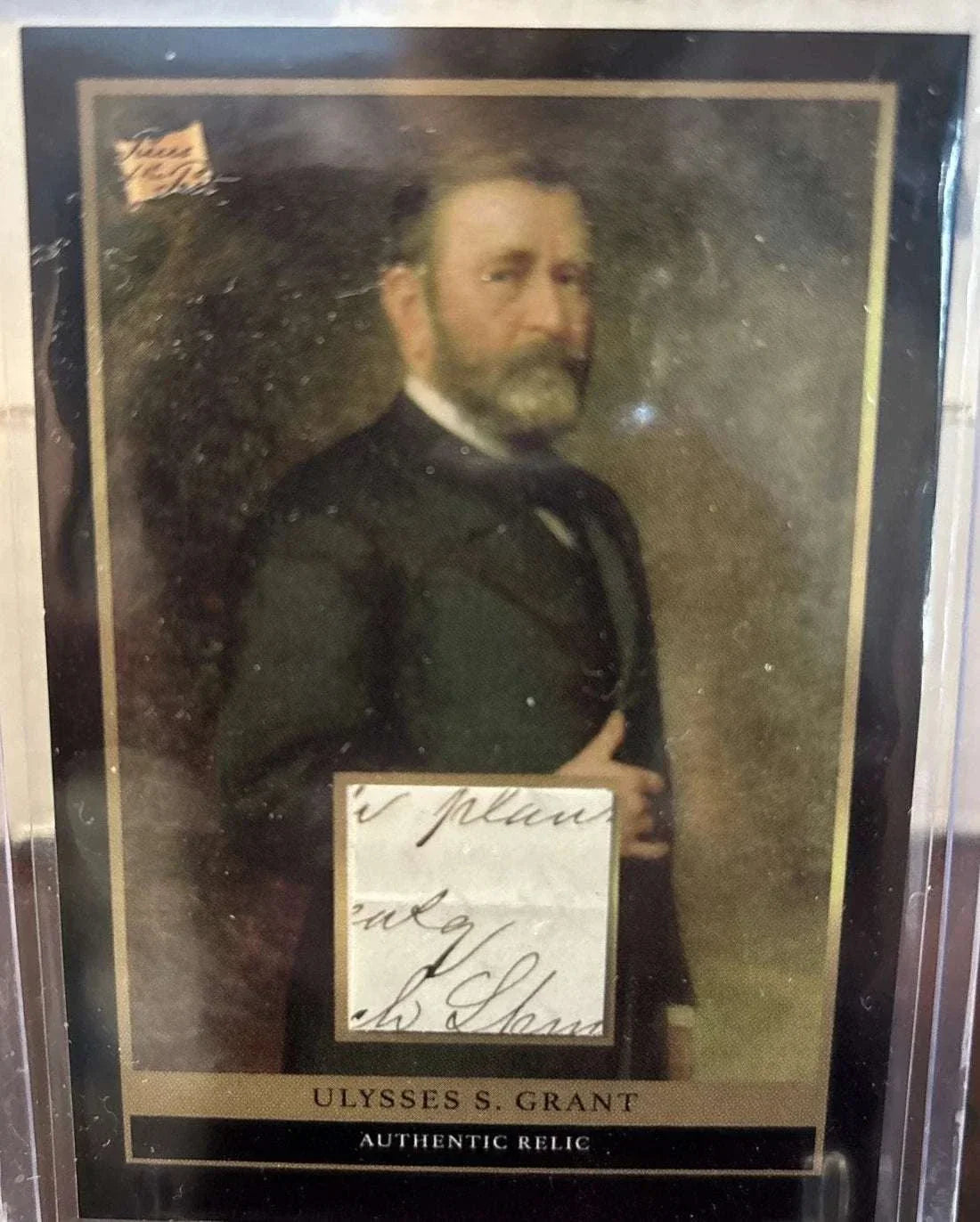 Ulysses S. Grant relic card featuring authentic handwriting fragment and presidential signature cut.
