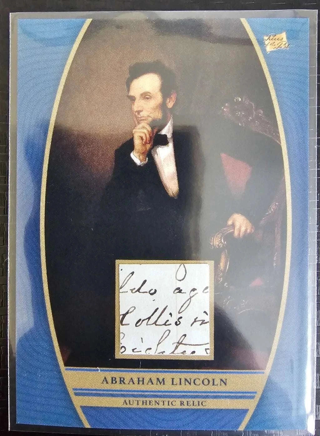 Abraham Lincoln authentic relic card with embedded handwriting fragment and classic portrait