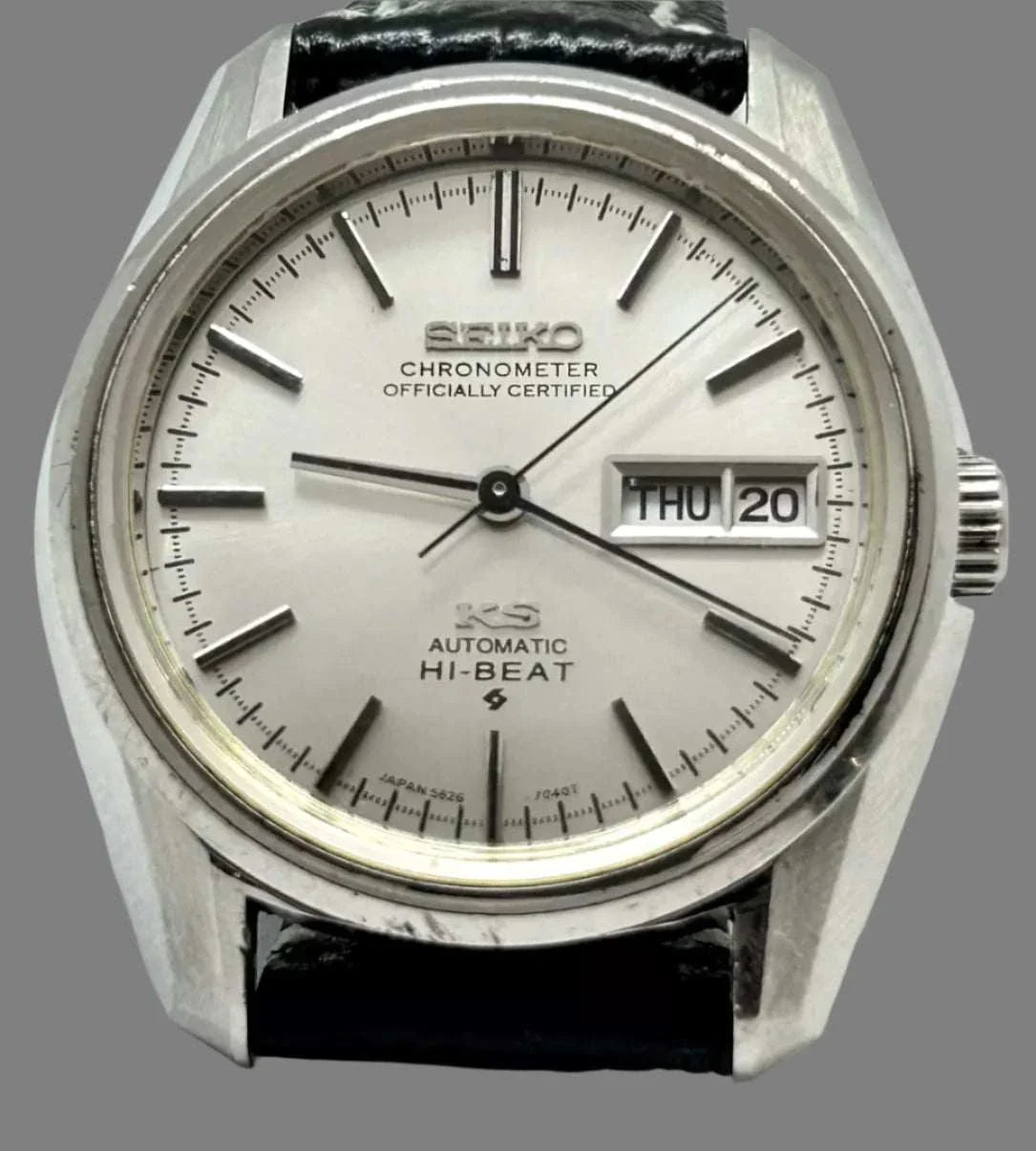 Vintage King Seiko Chronometer 5626-7041 watch with silver dial and black leather strap.