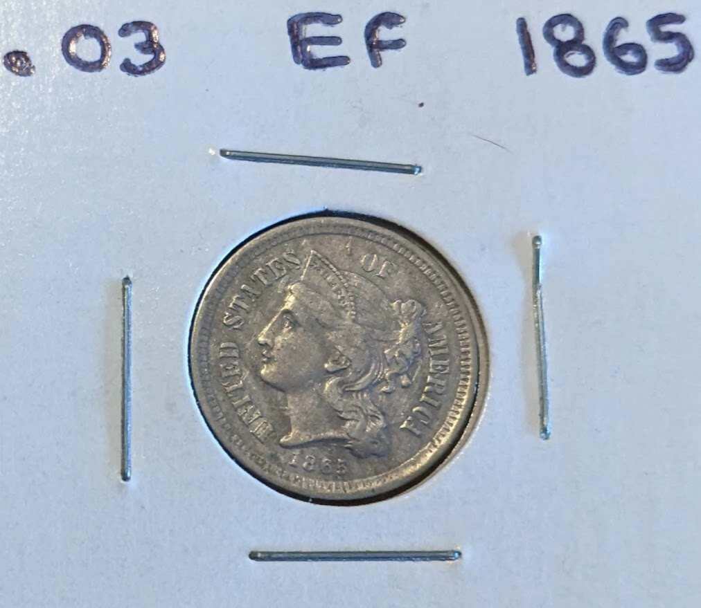 1865 Three-Cent Piece nickel coin in extra fine condition.